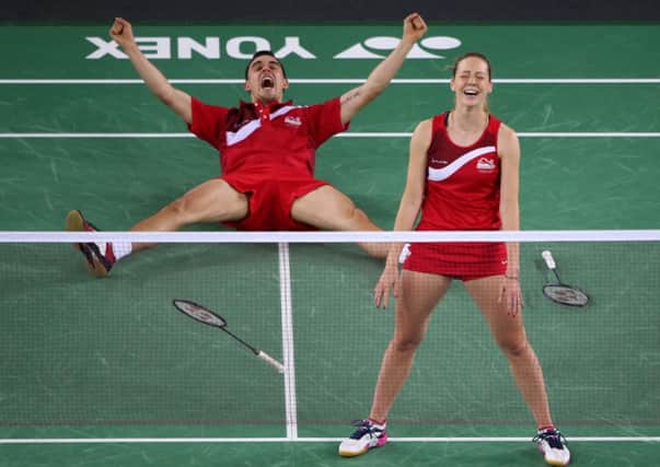 Leeds's Gabby Adcock and husband Chris celebrate their win in the mixed doubles final.