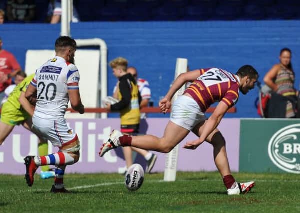 Huddersfield Giants' Jake Connor scores in the corner against Wakefield Trinity Wildcats.