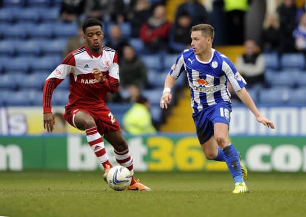 Middlesbrough's Kenneth Omeruo battles with Sheffield Wednesday's Chris Maguire.