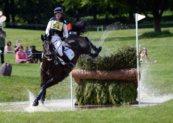 ANSWERING THE CALL: Nicola Wilson and Annie Clover, jumping one of the water fences at the Bramham International Horse Trials, have been selected for the World Equestrian Games. Picture: John Giles/PA
