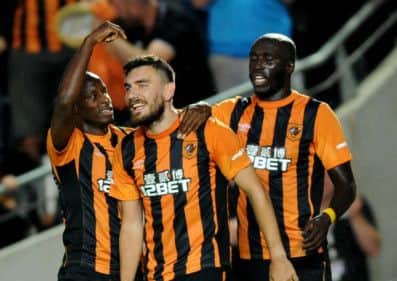 Hull's Sone Aluko points to Robert Snodgrass as he celebrates his winner.
