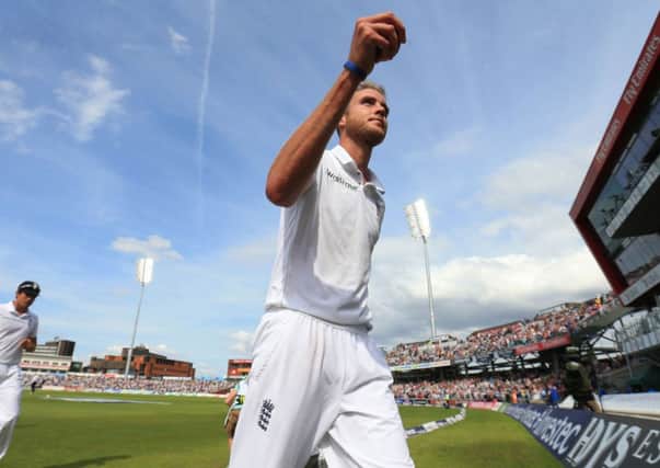 England's Stuart Broad leaves the field with the match ball after claiming six wickets.