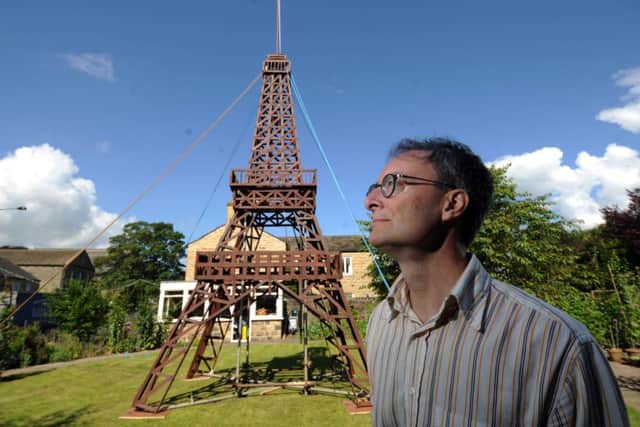 Charles Prest with the model of the Eiffel Tower at Burley in Wharfedale