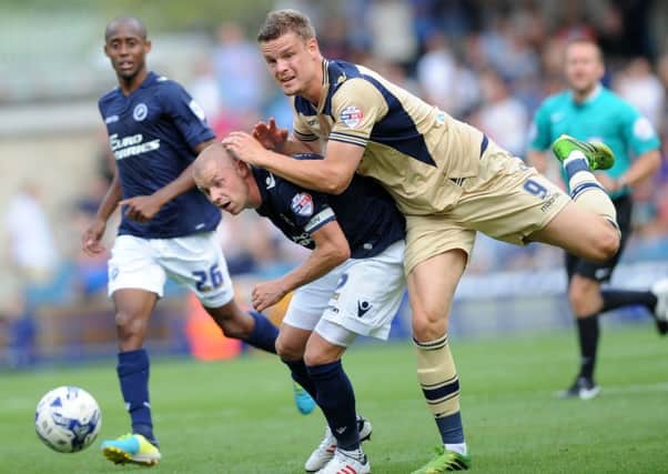 Leeds Matt Smith battles with Millwall's Alan Dunne. (Picture: Jonathan Gawthorpe)