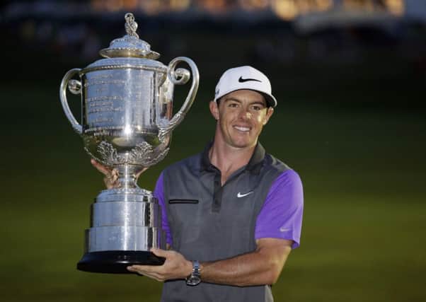 Rory McIlroy, of Northern Ireland, holds up the Wanamaker Trophy after winning the PGA Championship golf tournament at Valhalla.  (AP Photo/John Locher)