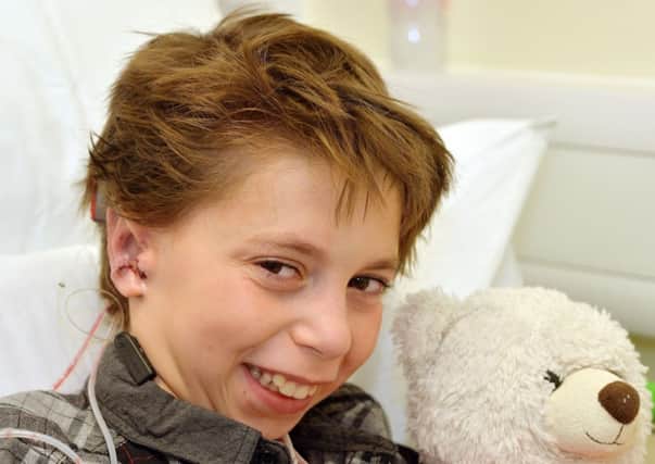 Kieran Sorkin, aged nine, who has a new set of ears created using cartilage from his ribs. Photo: John Stillwell/PA Wire.