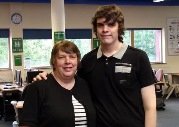 Thomas Lowson with his mother Jayne at Sheffield College. PIC: PA