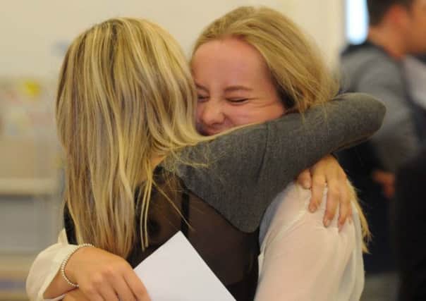Students at Roundhay School celebrate their A-Level results. PIC: Simon Hulme