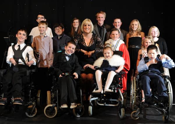 BBC's Stephanie McGovern and young comedy star Jack Carroll with the 2013 Children of Courage winners.