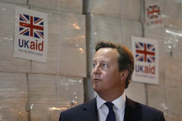 Prime Minister David Cameron during a visit to the UK Aid disaster response centre at Kemble Airport, Wiltshire.
