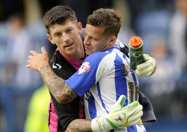 Sheffield Wednesday goalkeeper Keiren Westwood is congratulated by Chris Maguire at the final whistle (Picture: Steve Ellis).