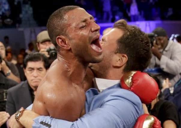 Kell Brook, left, celebrates his win against Shawn Porter during the IBF welterweight title boxing bout.