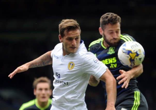 Billy Sharp, seen, left, during his Leeds United debut, could have yet more new team-mates at Elland Road (Picture: Simon Hulme).