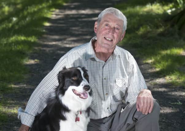 Barney the dog with owner David Russell