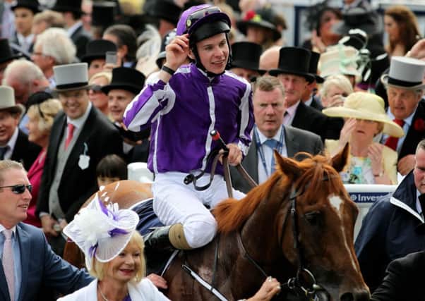 Joseph O'Brien acknowledges the crowd after his victory on Australia in the Investec Derby