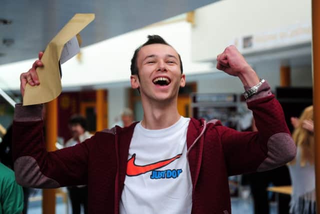 Cardinal Heenan Catholic High School  student 
Tom McLoughlin celebrates his GCSE results. PIC: Steve Riding