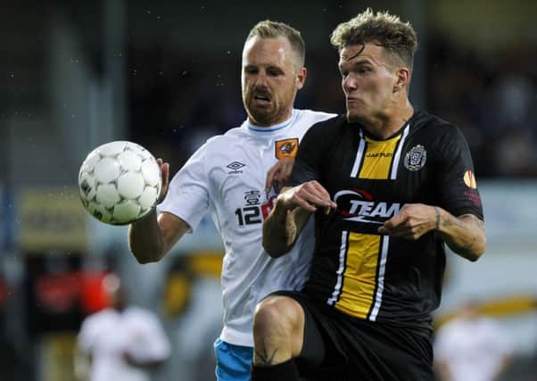 Hull's David Meyler (left) and Lokeren's Alexander Scholz battle for the ball.