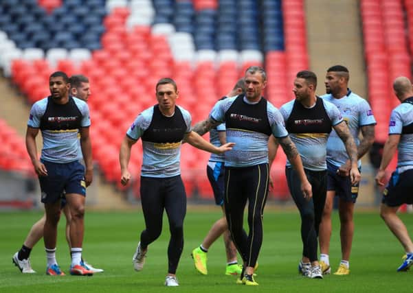 Leeds Rhinos players Kevin Sinfield (center) and Jamie Peacock lead the training during the Tetley's Challenge Cup Final walkabout at Wembley Stadium, London.