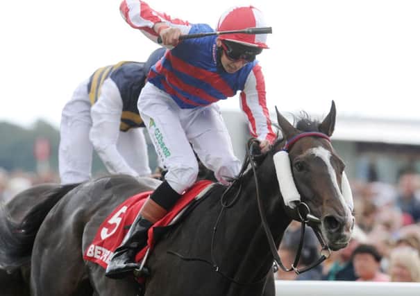 Louis Steward riding Mutual Regard celebrates as he wins the Betfred Ebor on Betfred Ebor Day during Day Four of the 2014 Welcome To Yorkshire Ebor Festival at York Racecourse, York.