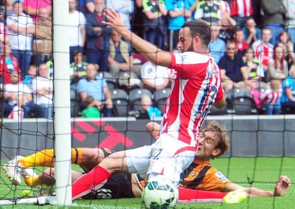 Nikica Jelavic slides in Hull's opener against Stoke. (Picture: Tony Johnson)