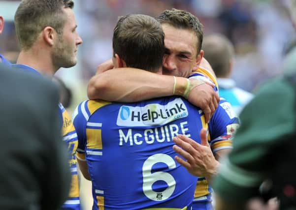 Kevin Sinfield celebrates with team-mate Danny McGuire.  Picture: Bruce Rollinson.