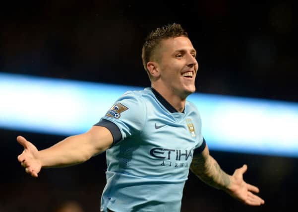 Manchester City's Stevan Jovetic celebrates scoring his and his side's second goal against Liverpool last night (Picture: Martin Rickett/PA Wire).