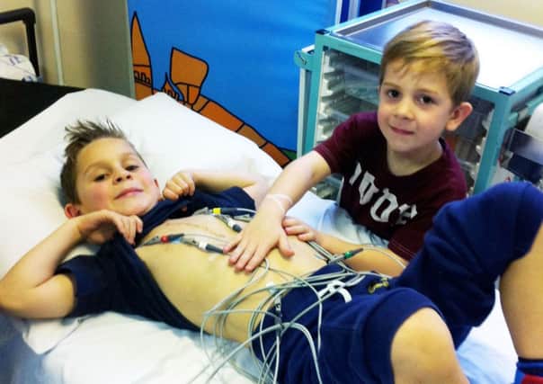 Daniel Harris (left), 10, with his brother Robbie. Daniel had to undergo surgery after doctors discovered a 10mm hole in his heart