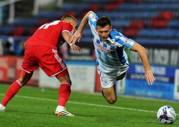 Huddersfield Town's Harry Bunn is brought down by Forest's Jack Hunt. Picture: Bruce Rollinson.
