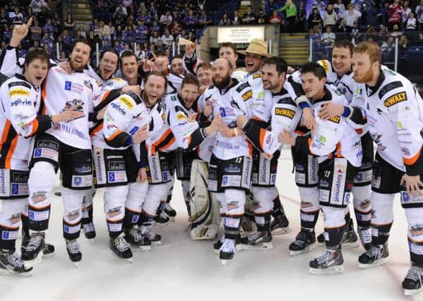 Sheffield Steelers celebrate last season's play-off success. But they will have to wait to raise the banner at the start of this campaign.