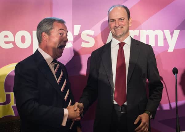 UKIP leader Nigel Farage (left) with  Douglas Carswell during a press conference in London