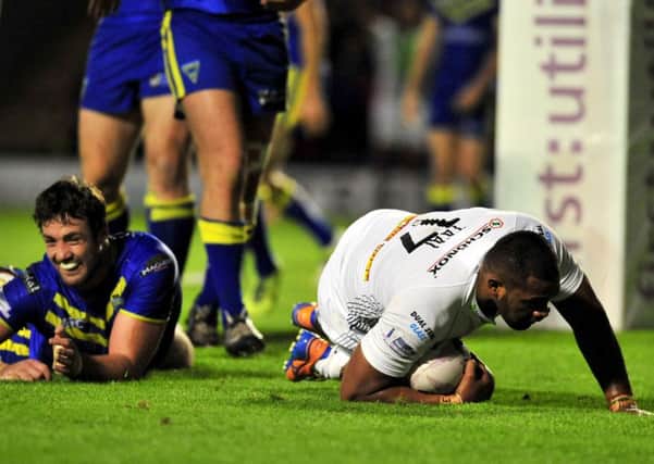 OVER THE LINE: Ukuma Ta'ai scores Huddersfield Giants' second try against Warrington Wolves.