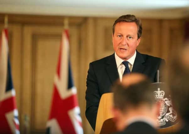 Prime Minister David Cameron speaks at a news conference in Downing Street