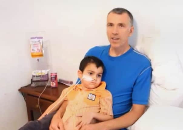 Brett King with his son Ashya and explaning why he was taken by his parents from hospital without doctors' consent on a video on YouTube.
Photo credit should read: Naveed King/YouTube/PA Wire