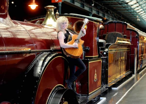 Singer Beth McCarthy, who recently starred on BBC's The Voice, warming up next to the Midlands Spinner No 673 Locomotive.