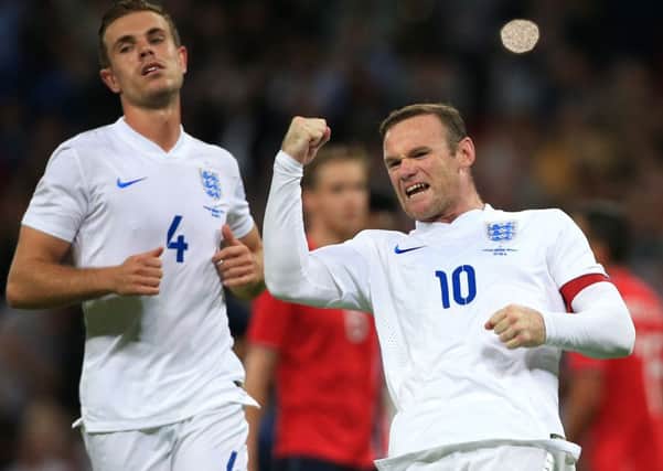 England's Wayne Rooney celebrates scoring England's winning goal.