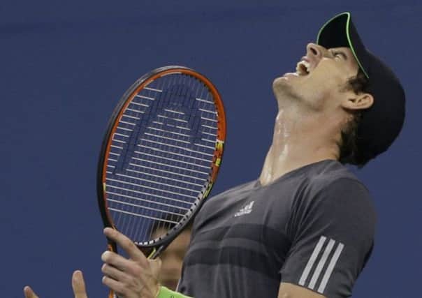 Andy Murray, of Britain, reacts after missing a shot against Novak Djokovic in their US Open quarter-final.