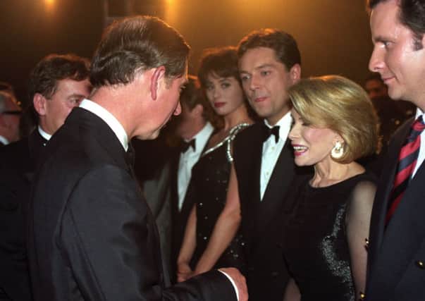 Prince Charles meeting Joan Rivers at the Royal Variety Performance in 1996
