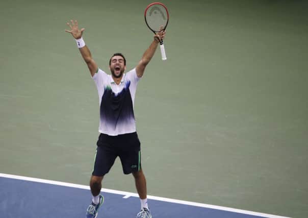 Marin Cilic, of Croatia, reacts after defeating  Roger Federer, of Switzerland, during the semifinals of the 2014 U.S. Open tennis tournament, Saturday, Sept. 6, 2014, in New York. (AP Photo/Julio Cortez)