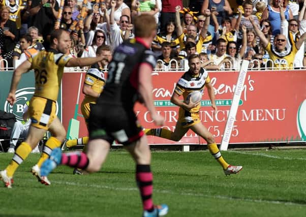 Castleford's James Clare runs in for a try.