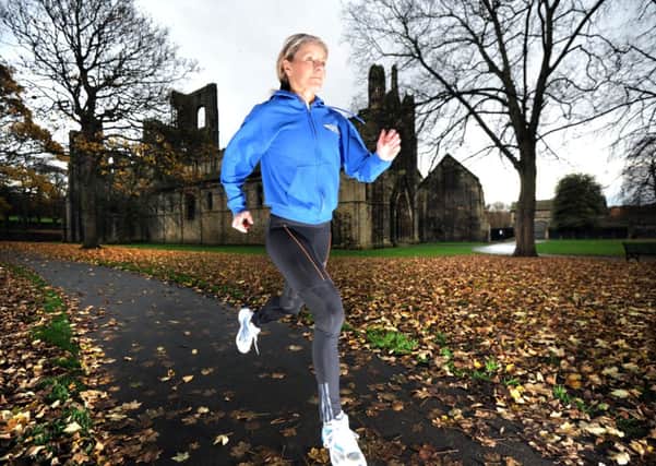 Former Olympic marathon runner Tracey Morris running at Kirkstall Abbeys.