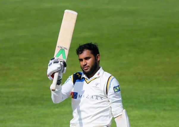 Adil Rashid, seen after completing his century against Lancashire, has been a key figure with bat and ball as Yorkshire chase the county title (Picture: Alex Whitehead/SWpix.com).