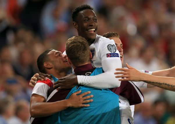 England's Danny Welbeck celebrates scoring his sides first goal against Switzerland.