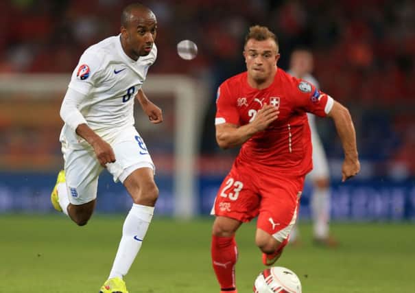 England's Fabian Delph (left) and Switzerland's Xherdan Shaqiri battle for the ball