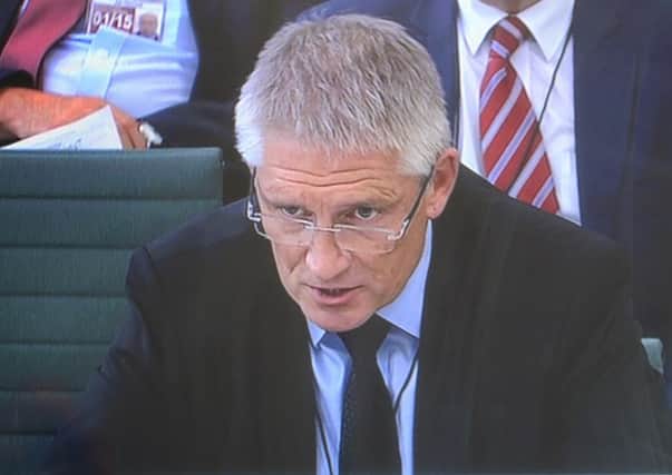 Meredydd John Hughes  faces questions from MPs