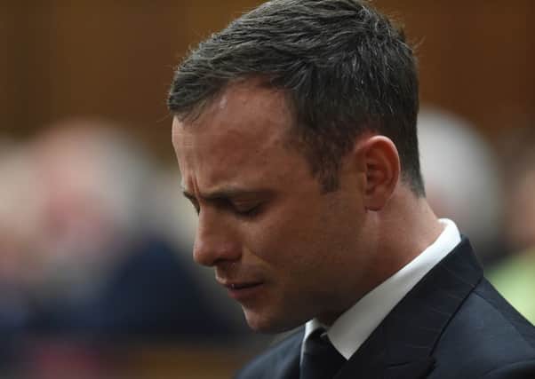 Oscar Pistorius cries in the dock as he listens to Judge Thokozile Masipa