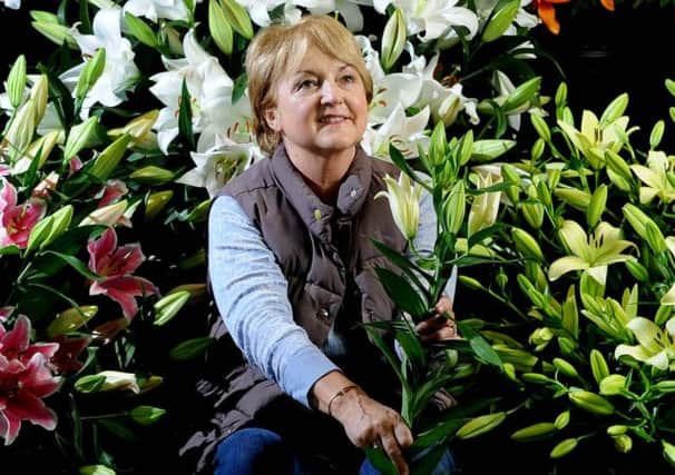 Loraine Hart from Hart's Nursery in Cheshire with a display of lilies
