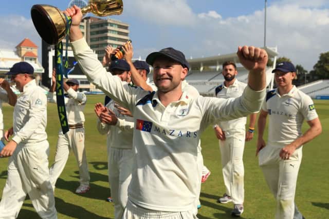 Yorkshire's Adam Lyth celebrates winning the Division One County Championship.