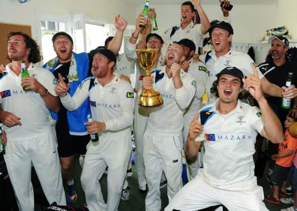 Yorkshire's players celebrate in their dressing room after winning the championship. Picture: Jonathan Gawthorpe.