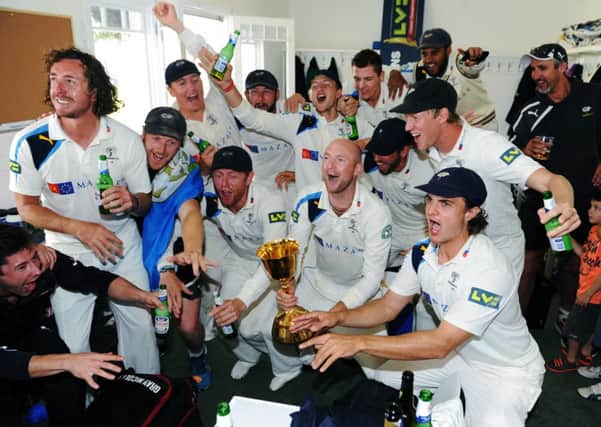 Yorkshire's players celebrate in their dressing room after winning the County Championship. Picture: Jonathan Gawthorpe.
