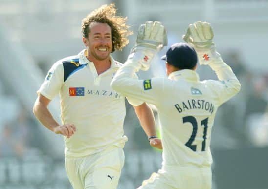 Yorkshire's Ryan Sidebottom is congratulated on taking the wicket of Nottinghamshire's Luke Fletcher by Jonny Bairstow. Picture: Jonathan Gawthorpe.
